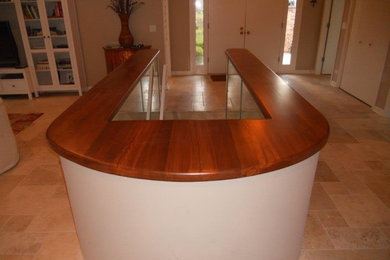 Example of a large transitional travertine floor and beige floor entryway design in Chicago with beige walls and a white front door