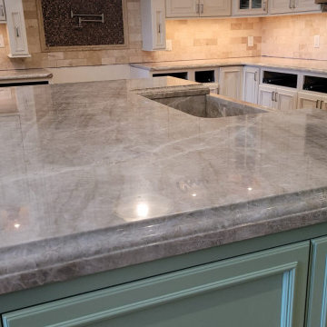 Victoria Falls & Ice Flakes countertops with stone farm sink