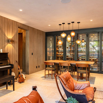 Modern Bronze Steel Wine Wall and Liquor Display in Luxury Custom Home Basement