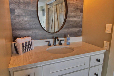 Example of a small farmhouse 3/4 brown tile medium tone wood floor and brown floor bathroom design in Miami with shaker cabinets, white cabinets, gray walls, an undermount sink, quartz countertops and white countertops