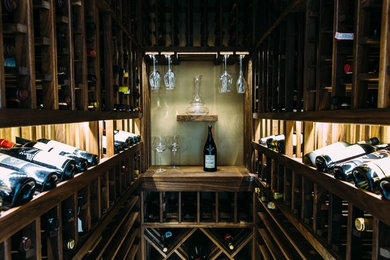 Wine cellar - small transitional marble floor wine cellar idea in Los Angeles