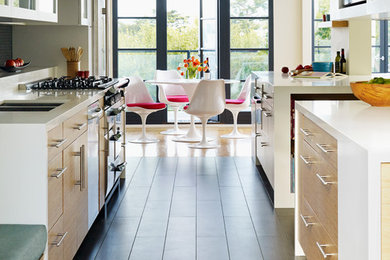 Mid-sized trendy galley dark wood floor open concept kitchen photo in San Francisco with light wood cabinets, flat-panel cabinets, gray backsplash, stainless steel appliances, subway tile backsplash, a double-bowl sink, quartz countertops and an island