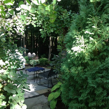 Hidden Patio with Steel-Ribboned Arbor