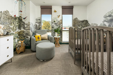 Large trendy gender-neutral carpeted and gray floor nursery photo in Atlanta with multicolored walls
