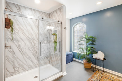 Inspiration for a large contemporary master vinyl floor, gray floor and double-sink bathroom remodel in Other with raised-panel cabinets, white cabinets, a two-piece toilet, gray walls, an undermount sink, granite countertops, gray countertops, a niche and a built-in vanity