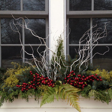 Christmas-themed window boxes with white willow twigs