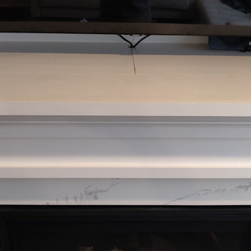 Hidden storage for A/V equipment behind mantel