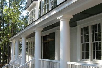 Farmhouse white two-story exterior home idea in Charleston