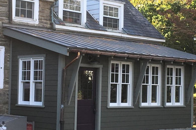 Mid-sized cottage gray two-story wood exterior home idea in Philadelphia with a mixed material roof