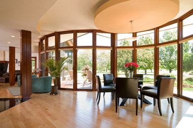 Inspiration for a mid-sized contemporary light wood floor and beige floor great room remodel in Chicago with beige walls