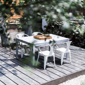 IKEA FALSTER Table and Tolix Chairs with Horizontal Plank Garden Fence and Garde