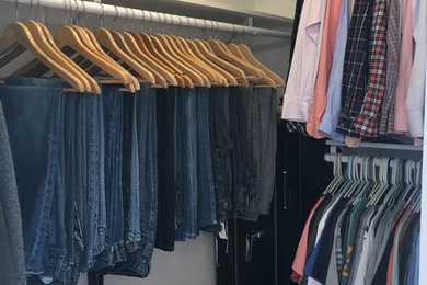 Mid-sized elegant gender-neutral walk-in closet photo in Other with open cabinets and white cabinets