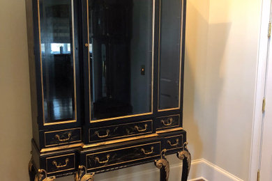 Chinoiserie painted on china cabinet.