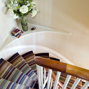 Inspiration for an eclectic carpeted curved staircase remodel in Boston
