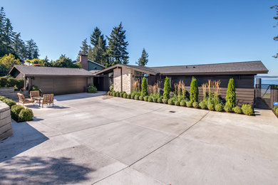 Example of a mid-sized trendy exterior home design in Seattle