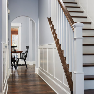 Antique Elm Flooring in a Traditional Hallway and Staircase