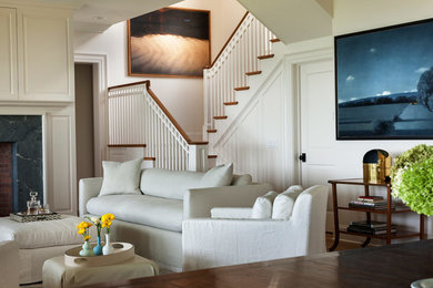 Living room - mid-sized traditional open concept medium tone wood floor living room idea in New York with white walls, a standard fireplace, a stone fireplace and a concealed tv