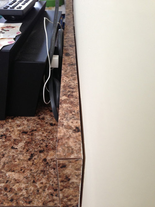 Normal for laminate countertop to separate from drywall in winter?