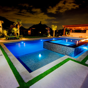 Modern Hillside Pool with Fire and Water Features