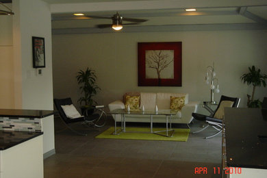 Inspiration for a large contemporary enclosed porcelain tile living room remodel in Dallas with gray walls, a standard fireplace, a tile fireplace and no tv