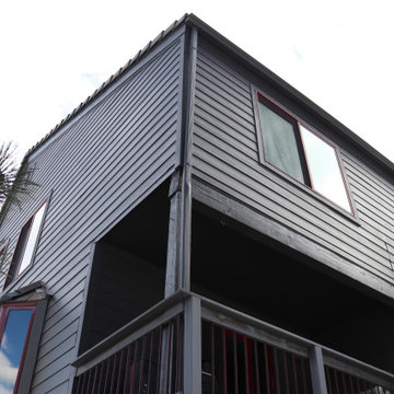 Dark Exterior Remodel | James Hardie Siding with Stone Accents