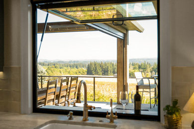 Mid-sized mountain style kitchen photo in Other with a farmhouse sink, beige backsplash, ceramic backsplash and gray countertops