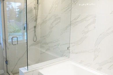 Bathroom - large contemporary master white tile and porcelain tile ceramic tile bathroom idea in Vancouver with flat-panel cabinets, medium tone wood cabinets, a one-piece toilet, white walls, a drop-in sink and quartz countertops