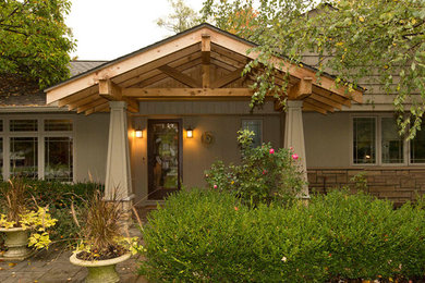 Inspiration for a craftsman beige one-story concrete fiberboard exterior home remodel in Cleveland