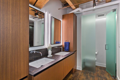 Inspiration for a mid-sized contemporary master bathroom in Minneapolis with flat-panel cabinets, medium wood cabinets, a corner shower, a wall-mount toilet, multi-coloured tile, porcelain tile, white walls, porcelain floors, an undermount sink, engineered quartz benchtops, multi-coloured floor, an open shower, black benchtops, a shower seat, a double vanity, a floating vanity and exposed beam.