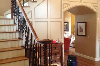 Mid-sized elegant light wood floor foyer photo in Other with beige walls