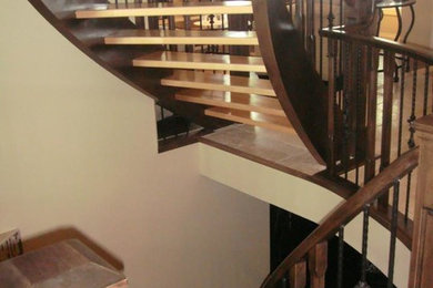Example of a classic tile staircase design in Calgary with wooden risers