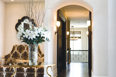 Inspiration for a marble floor entryway remodel in Calgary with white walls