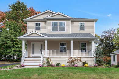 Mid-sized transitional beige two-story wood house exterior photo in New York with a hip roof and a shingle roof
