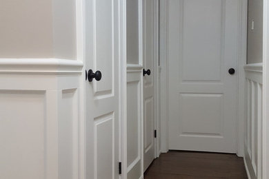 Wainscoting, crown molding, painting, doors, and hardware.