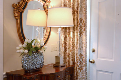 Mid-sized elegant carpeted entryway photo in Other with beige walls and a white front door
