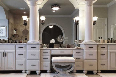 Example of a classic master bathroom design in Other with raised-panel cabinets, white cabinets, an undermount sink and granite countertops