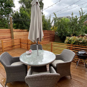 Millboard deck, artificial grass and cedar slat fencing in Reigate