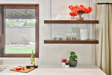 Example of a mid-century modern kitchen design in Phoenix