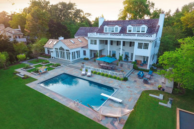 Large traditional white three-story wood gable roof idea