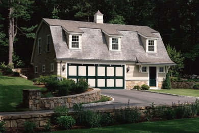 Inspiration for a farmhouse beige two-story mixed siding exterior home remodel in Providence with a gambrel roof