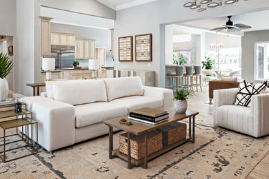 Example of a large beach style open concept light wood floor living room design in Philadelphia with blue walls, a standard fireplace and a stone fireplace