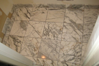 Example of a trendy powder room design in Newark