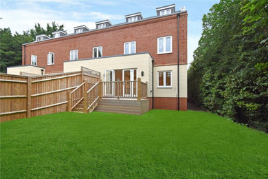 Photo of a medium sized contemporary back full sun garden for summer in Berkshire with a wood fence.