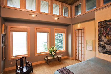 Example of a large master carpeted bedroom design in San Francisco with gray walls