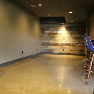 This is an example of a medium sized modern look-out basement in Other with beige walls, concrete flooring and yellow floors.