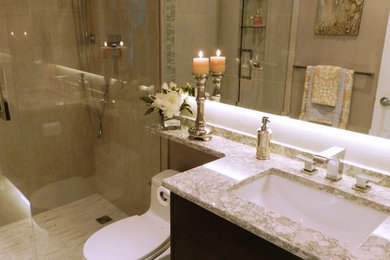 Small transitional master beige tile and porcelain tile porcelain tile doorless shower photo in Vancouver with flat-panel cabinets, dark wood cabinets, a two-piece toilet, gray walls, an undermount sink and quartz countertops