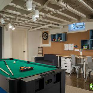 Small classic fully buried basement in Detroit with concrete flooring, brown floors and multi-coloured walls.