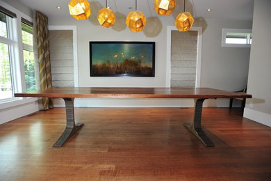 This is an example of an expansive contemporary dining room in Calgary.