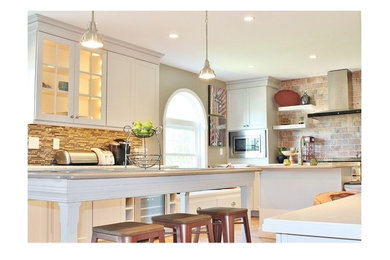 Mid-sized transitional u-shaped medium tone wood floor open concept kitchen photo in Philadelphia with a single-bowl sink, recessed-panel cabinets, gray cabinets, quartz countertops, red backsplash, stone tile backsplash, stainless steel appliances and two islands