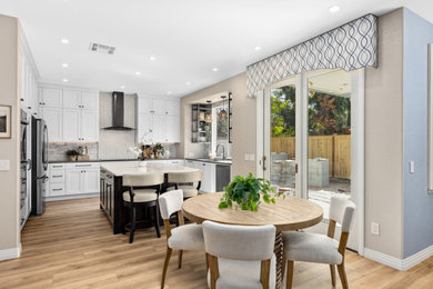 Inspiration for a large contemporary u-shaped vinyl floor and beige floor open concept kitchen remodel in San Diego with a single-bowl sink, shaker cabinets, white cabinets, quartz countertops, gray backsplash, glass tile backsplash, stainless steel appliances, an island and gray countertops